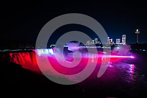 NIagara falls illuminated with color lights at night