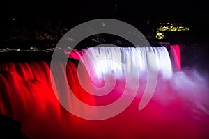 NIagara falls illuminated with color lights at night