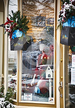NIAGARA ON THE LAKE,CANADA - DECEMBER 2, 2019: Fashion store showcase with Christmas decoration located in the Queen Street.