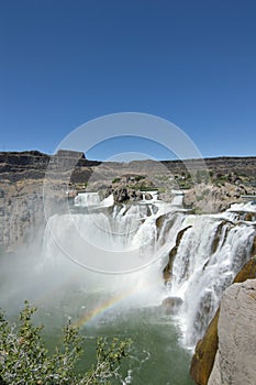 Win Falls Idaho Shoshone Falls mist with rainbow masthead text area wide angle vertical