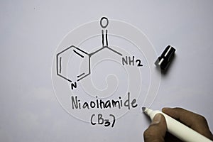 Niaoinamide B3 molecule written on the white board. Structural chemical formula. Education concept