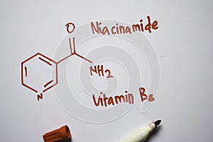 Niaoinamide Vitamin B3 molecule written on the white board. Structural chemical formula. Education concept