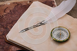 Nib and compass on blank page of copy book