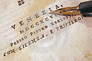 Nib (pen) over an old book photo