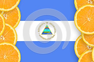 Nicaragua flag in citrus fruit slices vertical frame