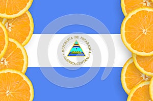 Nicaragua flag in citrus fruit slices vertical frame photo