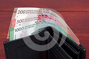 Nicaraguan cordoba in the black wallet photo