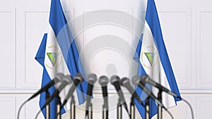 Nicaraguan official press conference. Flags of Nicaragua and microphones. Conceptual 3D rendering