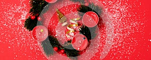 Nice Advent Wreath Red Candles Golden Christmas Ornaments on Red Background Snow Holiday Minimal Concept Top View Banner