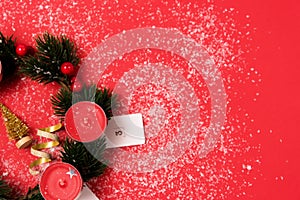 Nice Advent Wreath Red Candles Golden Christmas Ornaments on Red Background Snow Holiday Minimal Concept Top View Copy Space