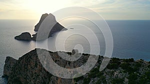 Nice aerial top view flight drone Sunset cliff Ibiza pirates island tower Spain