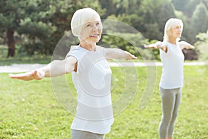 Nice aged woman exercising
