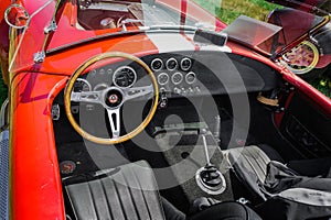 Nice amazing closeup view of classic vintage sport car instrument panel and dash