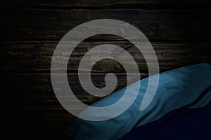 Nice any feast flag 3d illustration - dark photo of Luhansk Peoples Republic flag with big folds on old wood with free space for