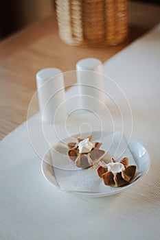 Nice appetizer snacks - tartlets on a white ceramic plate.