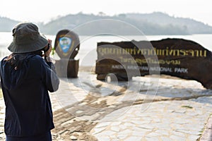 Nice Asian female tourists taking pictures at KaengKrachan national park, KaengKrachan national park is the biggest National Park