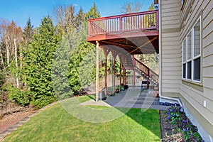 Nice back porch with covered patio and decor.