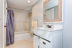 Nice bathroom interior with a vanity cabinet. photo