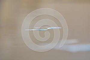 Nice blue effect of light on water drops on a polycarbonate table