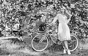 Nice bouquet. lady walk in park. pink cherry tree blossom. girl carry flower in retro bicycle. spring beautiful woman in