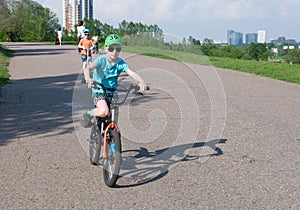 Nice boy cycling in the park