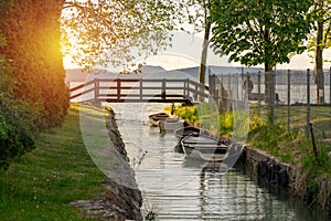 nice bridge with a small canal in Balatonbolar and fishng boats next to Lake Balaton