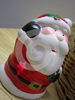 Bright Christmas Santa Claus ornament on a table