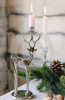 Nice candlestick designed as a deer opposite
