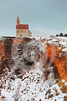 Nice Catholic Chapel in eastern Europe at winter landscape - village Drazovce