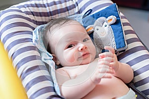 Nice and cheerful baby in hammock for babies of rallas photo
