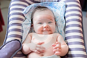Nice and cheerful baby in hammock for babies of rallas photo