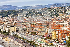 Nice cityscape of old town, sea promenade, hillside villas, mountain range