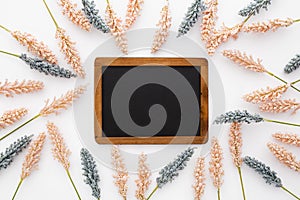 Nice composition made of wheat leaves and a blackboard with copyspace in the center