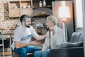 Nice content man talking with an aged man