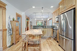 Nice country home wood kitchen with wooden island and ligth green tiles photo