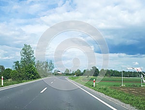 Nice country road with blue sky and white clouds