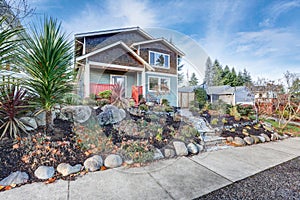 Nice Craftsman home exterior on blue sky background