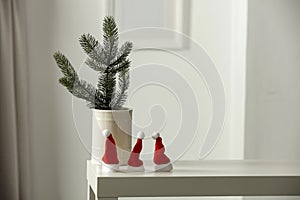 Christmas decorations in bright white colors with Christmas decorations, picture frames with blurred white wall background.