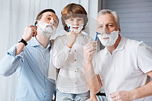 Nice delighted family shaving together