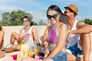 Nice delighted friends having a picnic