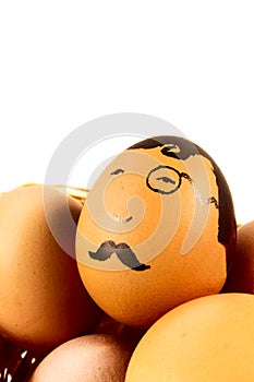 Nice eggs in basket with hipster face