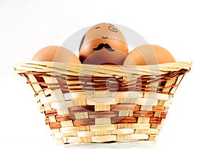 Nice eggs in basket with hipster face