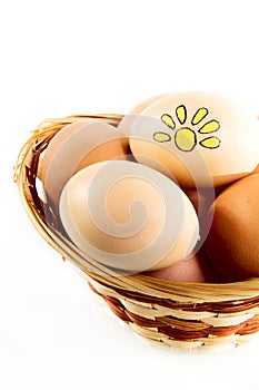 Nice eggs with sun sign in basket