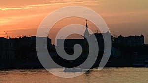 Nice evening Kiev city view from left coast of Dnipro river at summer sunset time