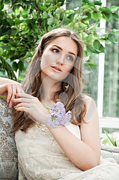 Nice Fashion Model Woman on Vintage Sofa