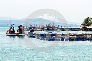 Nice fishing boat and cage aquaculture farming.