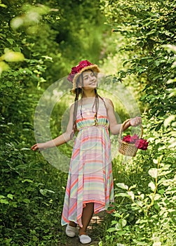 Nice flowers. little girl holding pink fresh blossoming flower bouquet of roses. flower composition. Beautiful girl in