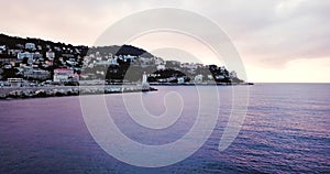 Nice, France, Aerial footage of lighthouse. Beautiful sunrise above the Mediterranean Sea. Cote D Azur