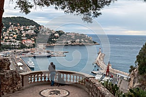 Nice, France. Aerial view of the old port of Nice, big cruise liners, lighthouse and city on the hill.