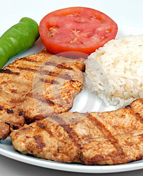 Nice fryied Chicken with rice and tomato photo